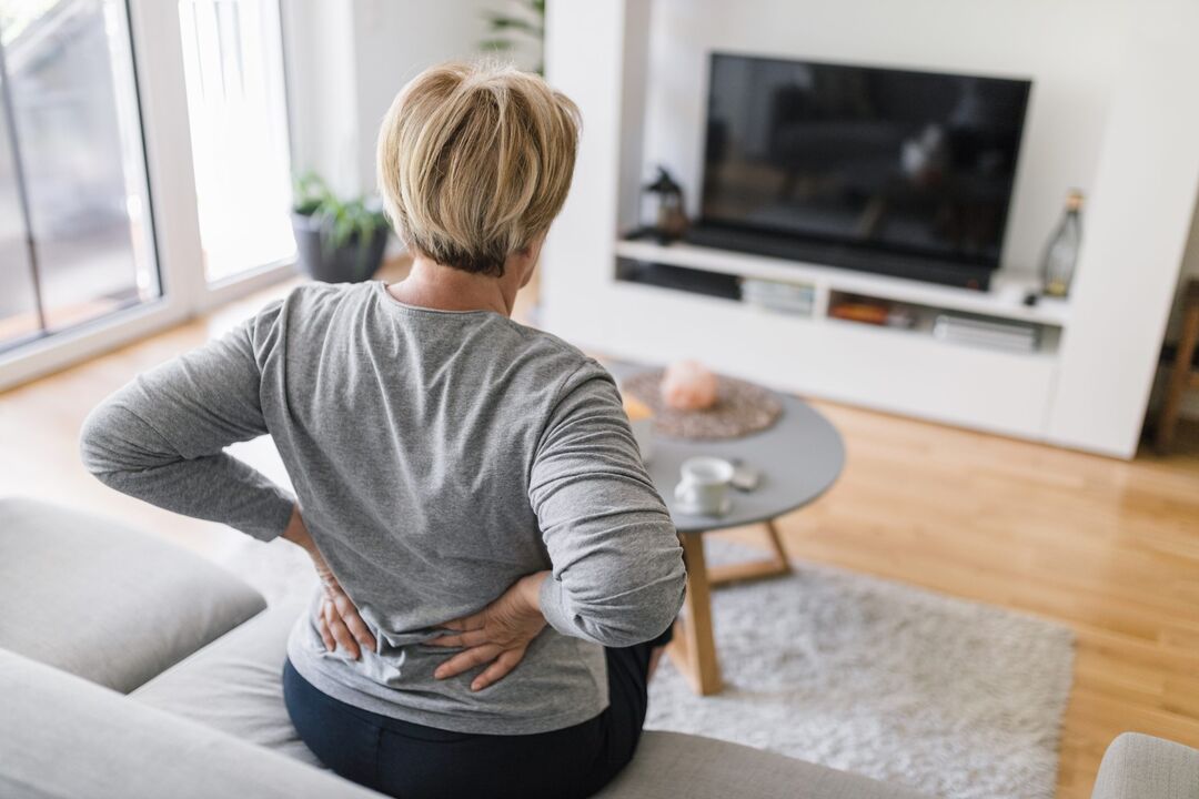 A woman is concerned about back pain in the lumbar region